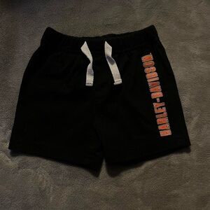 Harley Davidson black and orange shorts.